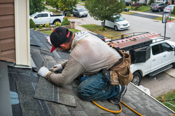 Professional Gutter Installation technician working in Quincy, MA